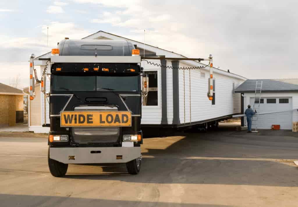 This is a photo of a transport truck on the way to relocate a mobile home. This is carried out by Mobile Home Movers Knoxville TN